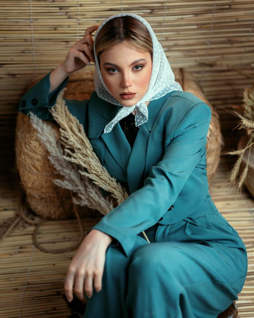women in scarf and blue suit