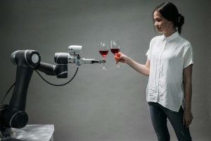 Robot and lady toasting wine glasses